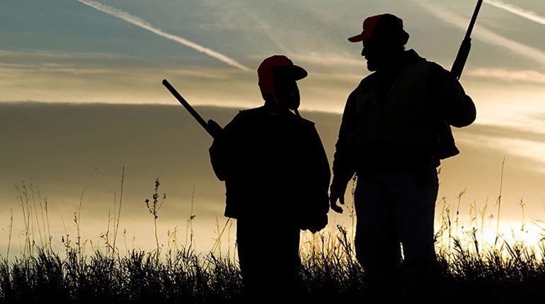 Father and Son Hunting with Shotguns