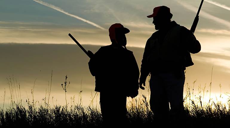 Father and Son Hunting with Shotguns